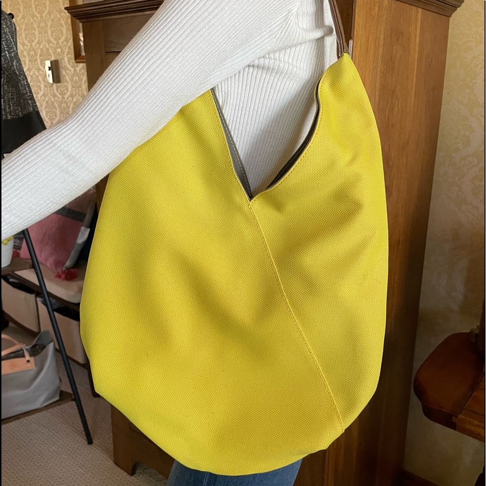 One of a kind repurposed material bag handmade from Japan.